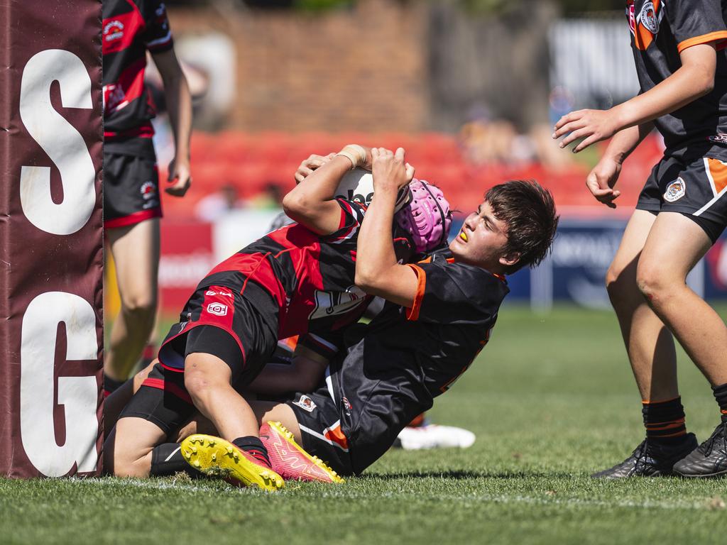 Hunter Collins of Valleys is tackled by Harrison Parsons of Southern Suburbs in U13/14 boys Toowoomba Junior Rugby League grand final at Toowoomba Sports Ground, Saturday, September 7, 2024. Picture: Kevin Farmer