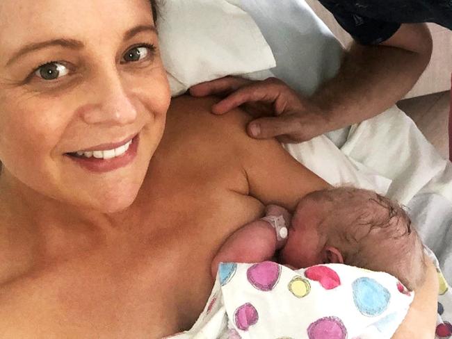 Instagram image of Carrie Bickmore with her newborn daughter Adelaide and partner Chris Walker.