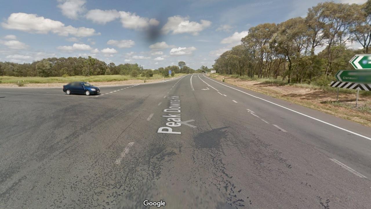 A driver was trapped in their car in a single-vehicle afternoon crash on the corner of a busy Queensland highway, but escaped before the car caught fire. UPDATE