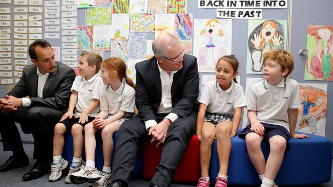 Prime Minister Scott Morrison and Dave Sharma, Liberal candidate for Wentworth, chat with Year 1 students (from left) Ben, Grace, Tayla and Cormac during a visit to Galilee Catholic Primary School in North Bondi. Picture: Jonathan Ng