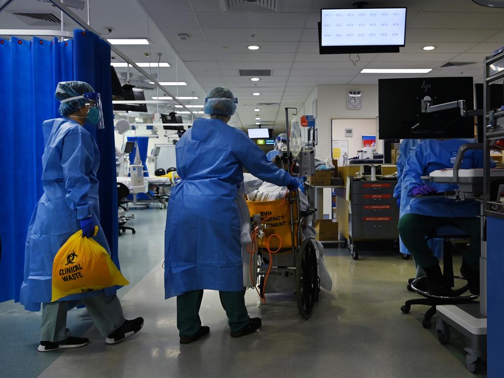 ICU staff prepare a Covid patient for transfer. Picture: Kate Geraghty