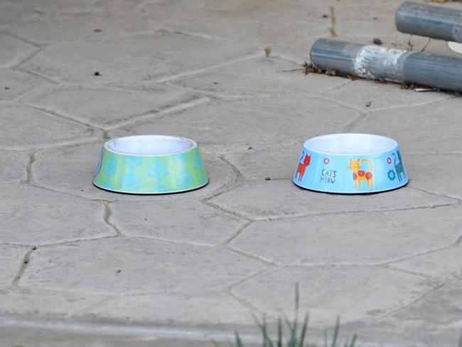 Dog bowls seen in exterior photographs taken of the Turpin family home in Perris, California. Picture: Stewart Cook/The Sun