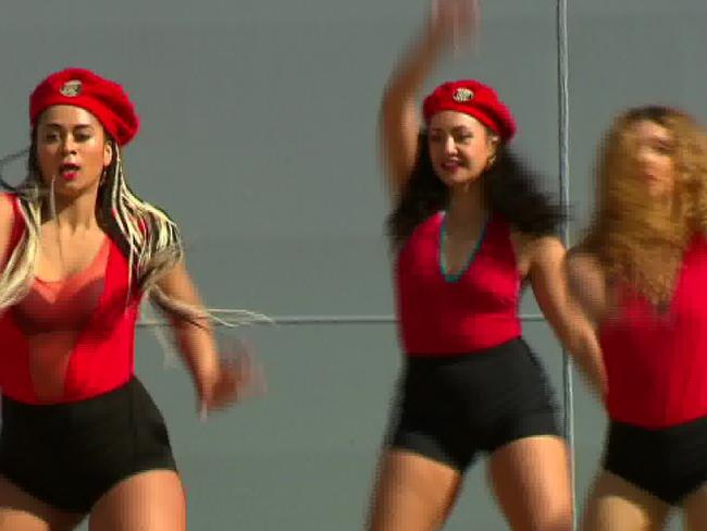 The Royal Australian Navy organised scantily clad dancers to help formally commission the Navy's newest ship, to the suprise of many., Picture: ABC