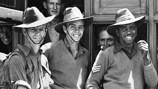 A young Reg Saunders surrounded by his mates in the AIF, in a photograph part of the For Country For Nation travelling exhibition. Image courtesy of the Australian War Memorial.