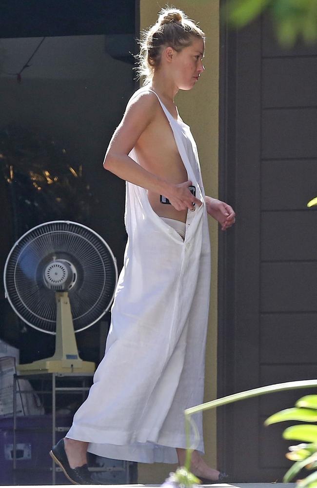 Amber Heard Has Wardrobe Malfunction In Loose Fitting Dress Photos
