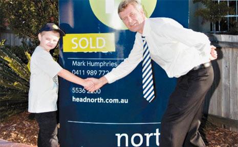 LACHLAN Shields wants to be a real estate agent, just like Mark Humphries, principal of North Estate Agents in Tweed Heads. Picture: Tweed Daily News