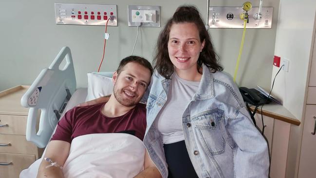 Constable Randall Kirk with wife Bree in hospital after surgery to remove shrapnel. Picture: Queensland Police Union of Employees.