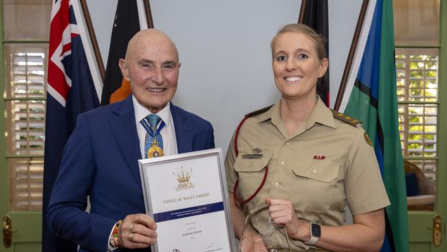 Administrator of the Northern Territory, His Honour Professor the Honourable Hugh Heggie PSM presents The Prince of Wales Award to Lieutenant Jacqueline Martin during a ceremony held at Government House, Darwin, NT. *** Local Caption *** The Prince of Wales Award (POWA) provides the opportunity for selected reservists to undertake a training or development activity, which is directly related to and benefits their civilian occupation or profession. Excitingly, with this being the 40th year of the awards, we are celebrating the longstanding history by including some of our former alumni recipients in the celebrations this year. The Prince of Wales Award ceremony is a formal event held at Government House. There are two 2024 recipients to be awarded with their Employer. The recipient will also have their CO and personal guest in attendance. The two award recipients are Sergeant Pamela Dillon and Lieutenant Jacqueline Martin. Air Commodore Grant Pinder will be representing Reserve Cadet Support Division, there will also be other NT senior service representatives and POWA alumni.