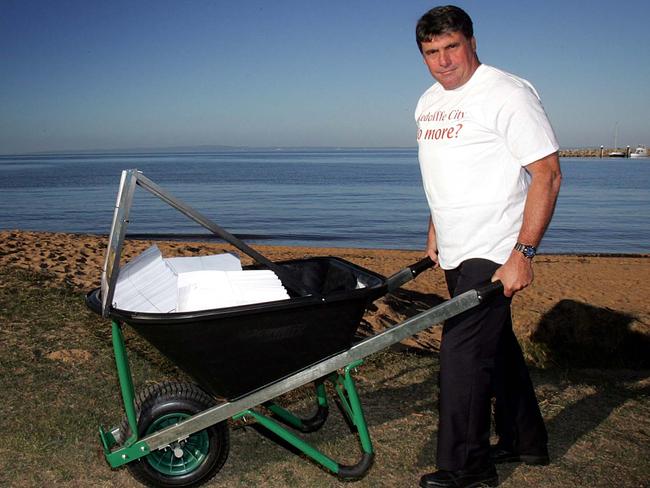 Then Redcliffe mayor Allan Sutherland in 2007 with the wheelbarrow of petitions he pushed 42km to Parliament House.