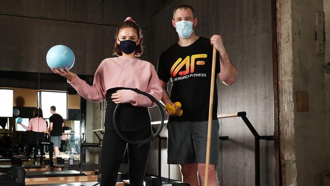 Mahalia Woodham pilates instructor and Rob Ole person trainer at All Aerobics Fitness in Hobart in the pilates studio area of the gym where masks need to be worn. Picture: Nikki Davis-Jones