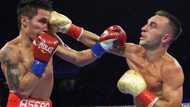 Jason Moloney (right) lands a punch on Vincent Astrolabio. Picture: Mikey Williams/Top Rank Inc via Getty Images