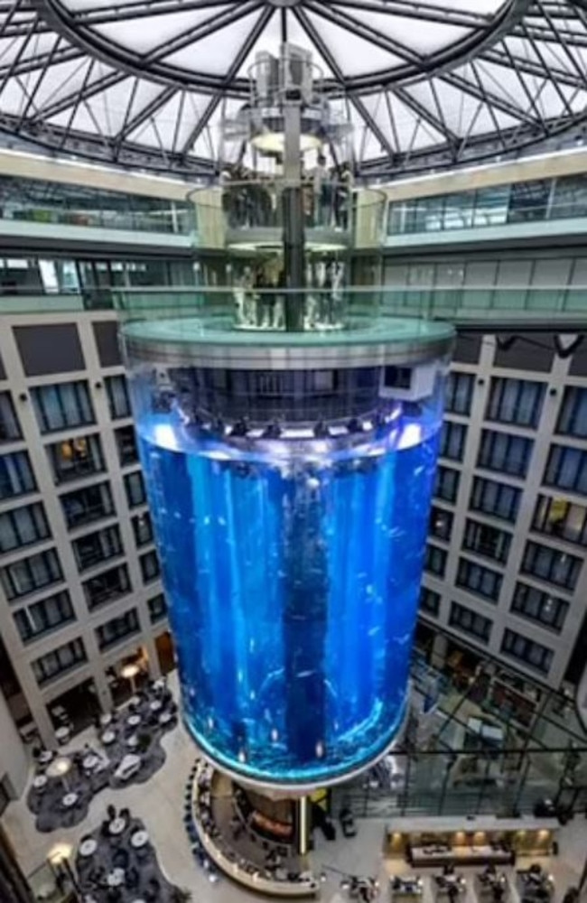 This massive aquarium burst, spilling fish, water and glass across a hotel lobby and into the street. Picture: Facebook / Raddison Blu
