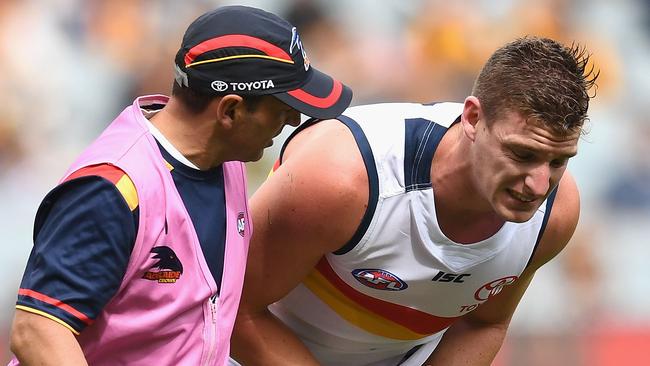 Josh Jenkins being helped from the field after the heavy hit. Picture: Getty