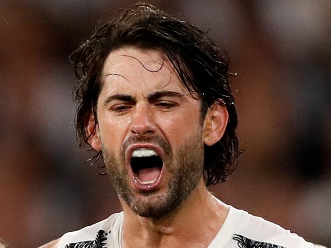 MELBOURNE, AUSTRALIA - APRIL 25: Brodie Grundy of the Magpies celebrates a goal with teammates during the 2022 AFL Round 06 match between the Essendon Bombers and the Collingwood Magpies at the Melbourne Cricket Ground on April 25, 2022 in Melbourne, Australia. (Photo by Dylan Burns/AFL Photos via Getty Images)