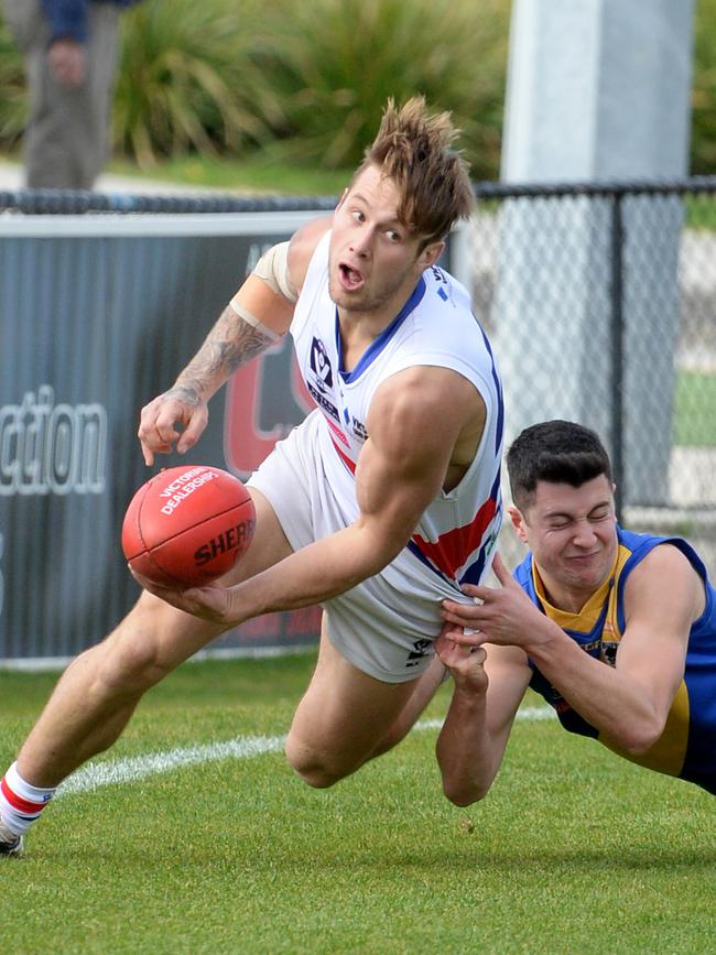 Mitch Jensen fires off a handball while playing for Footscray. Picture: Kylie Else