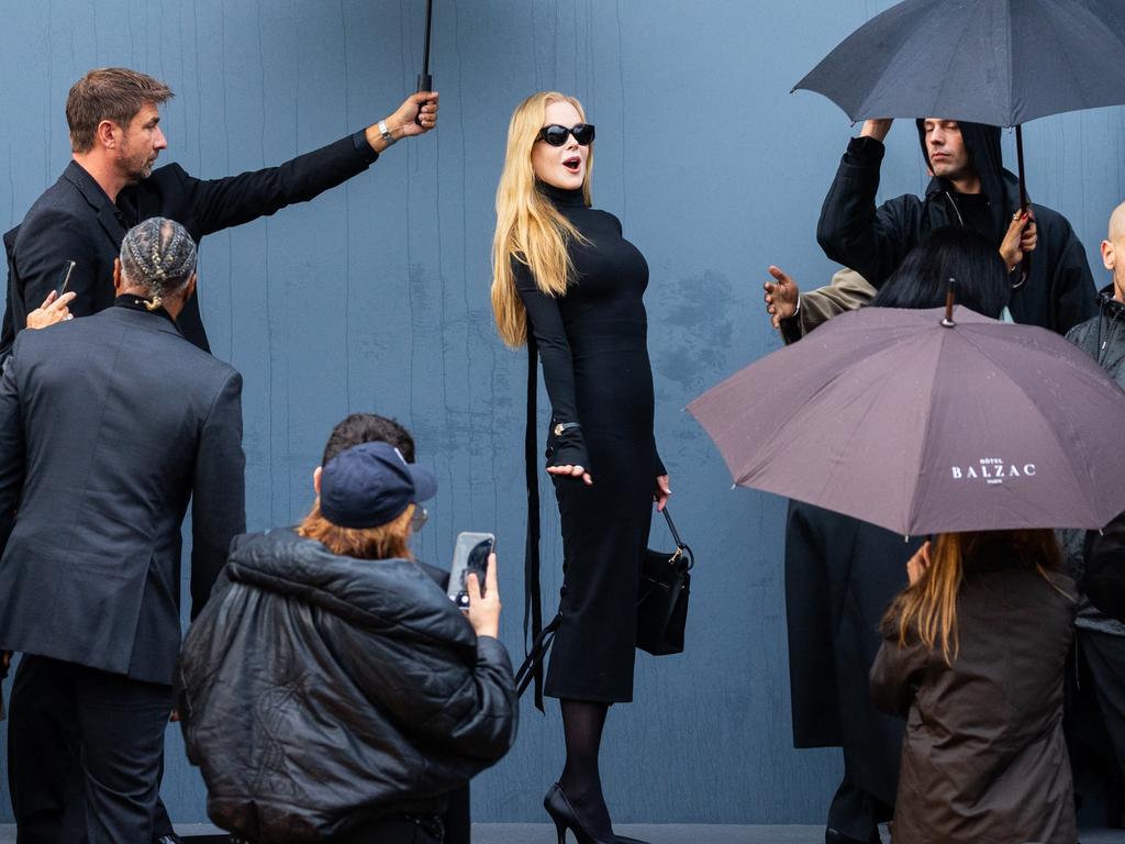 No one was going to rain on Nicole Kidman’s parade as she has a team of umbrella holders at the Balenciaga show in Paris. Picture: Splash/Backgrid