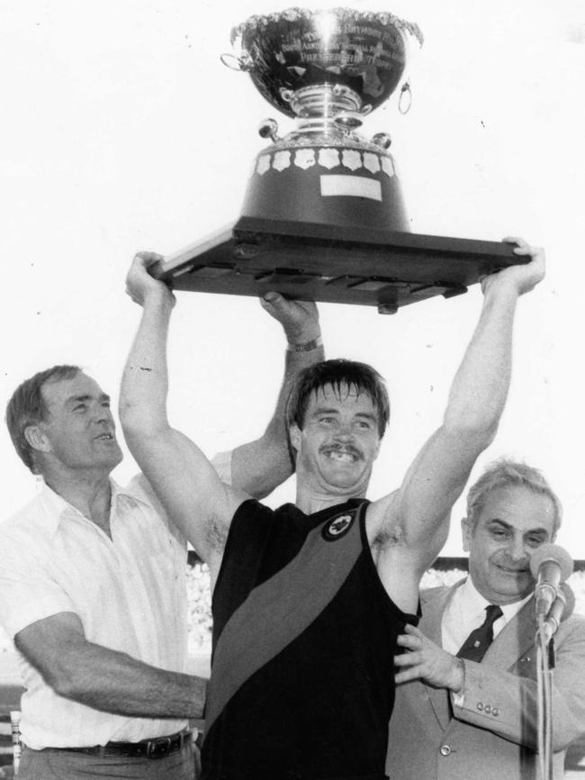 FLASHBACK: Neil Kerley, West’s Ian Borchard and SANFL chief Max Basheer after the Bloods claimed the 1983 grand final.