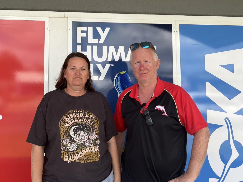 Ray and Anne Fursman standing at the front of their Intersport store in Yeppoon