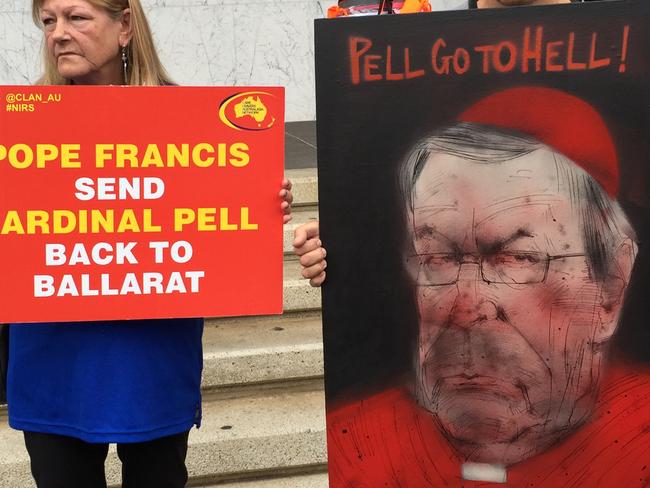 Protesters target Cardinal George Pell outside the Royal Commission into Institutional Responses to Child Sexual Abuse in Ballarat. Picture: AAP Image/Megan Neil.