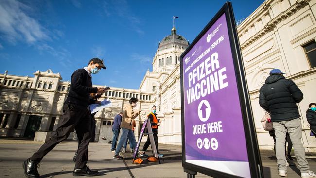 The Royal Exhibition Building vaccination centre in Carlton is busy with Pfizer bookings.