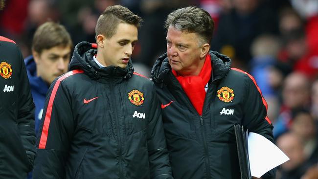 MANCHESTER, ENGLAND - FEBRUARY 28: Manager Louis van Gaal of Manchester United speaks to Adnan Januzaj of Manchester United at half time during the Barclays Premier League match between Manchester United and Sunderland at Old Trafford on February 28, 2015 in Manchester, England. (Photo by Alex Livesey/Getty Images)