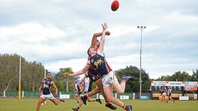 Saints Nathan Edwards and Lions Nicholas Johnson compete for the ball. PICTURE: JUSTIN BRIERTY