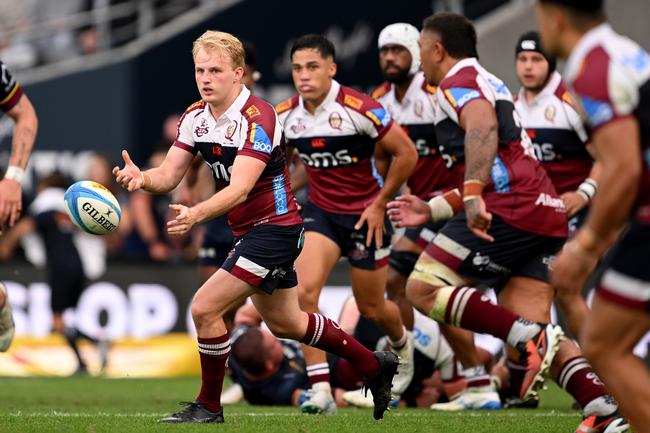 Tom Lynagh of the Reds passes the ball during the round six Super Rugby Pacific match between Highlanders and Queensland Reds. Photo by Joe Allison/Getty Images