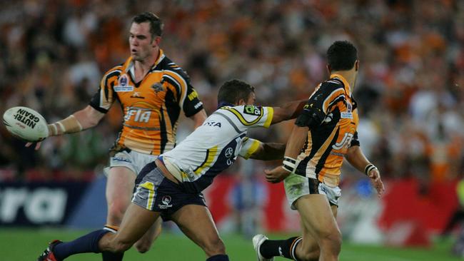 Matt Bowen can’t do a thing after Marshall throws that magical pass to Richards in the 2005 Grand Final. Picture: Brett Costello