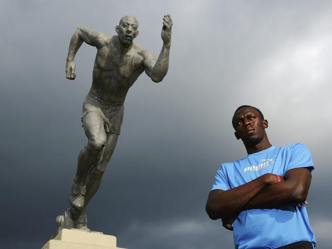 Usain Bolt, the 200m and 400m sprinter poses in front of ‘The Sprinter’ statue at the National Stadium on October 17, 2006 in Kingston, Jamaica. Picture: Getty