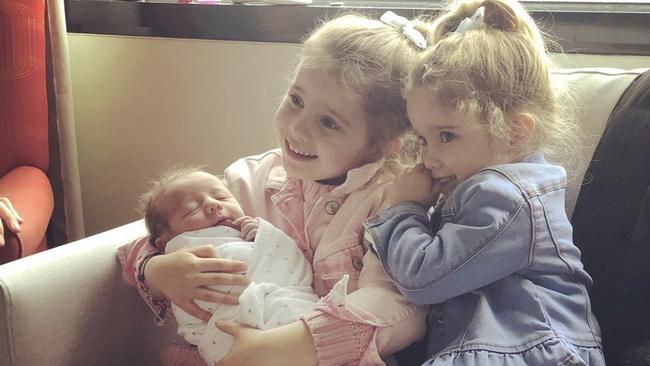 Cotchin’s daughters with their new baby brother. Picture: Instagram