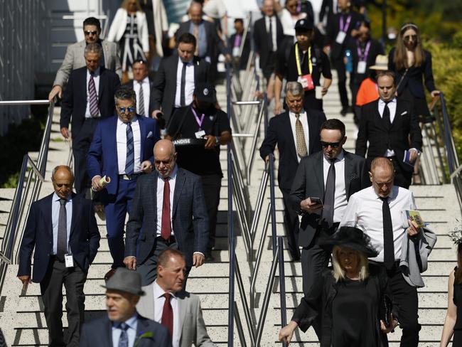 Crowds flood into Flemington. Picture: Daniel Pockett