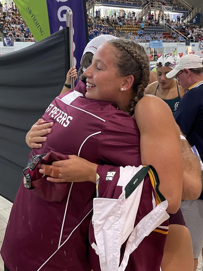 Amelia Weber is congratulated by St Peters director of sport Shaun Nodwell earlier this year.