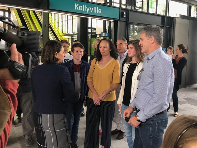 Premier Gladys Berejiklian speaks to Bruce Cleaver, project manager of the Epping to Chatswood project, and his family, at Kellyville station. Picture: Lawrence Machado