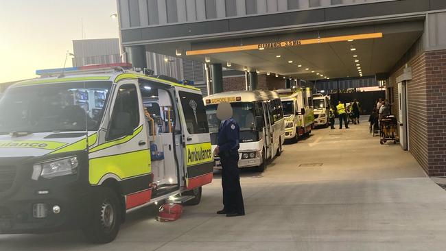 Ambulances transport children injured in the school bus crash to Roma Hospital.