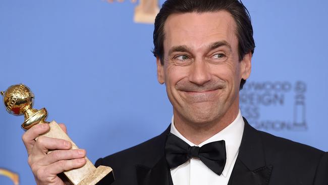 Jon Hamm poses in the press room with the award for best performance by an actor in a TV series - drama for “Mad Men” at the 73rd annual Golden Globe Awards on Sunday, Jan. 10, 2016, at the Beverly Hilton Hotel in Beverly Hills, Calif. (Photo by Jordan Strauss/Invision/AP)