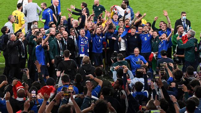 Italy celebrate in front of fans after victory in the UEFA Euro 2020 Championship Final between Italy and England at Wembley Stadium on Sunday. Photo: Facundo Arrizabalaga - Pool/Getty Images