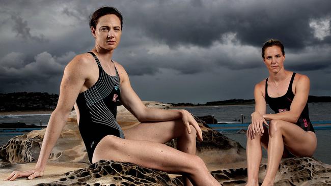 Olympic swimming stars Cate, left, and Bronte Campbell at Dee Why Beach in Sydney after hearing of the postponement of the Tokyo Games. Picture: Phil Hillyard