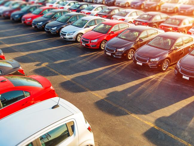 Dealer New Cars Stock. Colorful Brand New Compact Vehicles For Sale Awaiting on the Dealer Parking Lot. Car Market Business Concept.