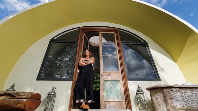 Cath Wild outside her dome home she designed and built at Flaxton in the Sunshine Coast hinterland. Picture Lachie Millard