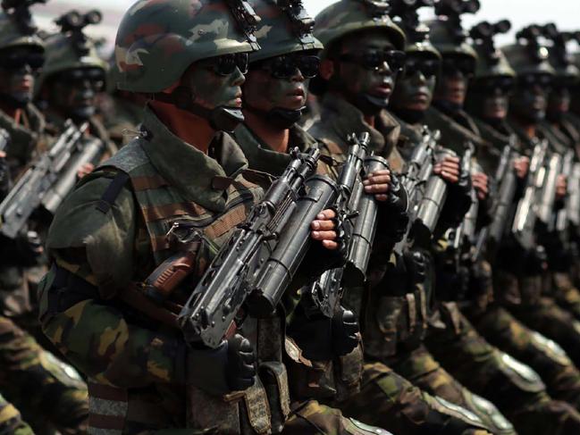 This April 15, 2017 picture released from North Korea's official Korean Central News Agency (KCNA) on April 16, 2017 shows Korean People's Army (KPA) soldiers marching through Kim Il-Sung square during a military parade in Pyongyang marking the 105th anniversary of the birth of late North Korean leader Kim Il-Sung. / AFP PHOTO / KCNA VIA KNS / STR / South Korea OUT / REPUBLIC OF KOREA OUT   ---EDITORS NOTE--- RESTRICTED TO EDITORIAL USE - MANDATORY CREDIT "AFP PHOTO/KCNA VIA KNS" - NO MARKETING NO ADVERTISING CAMPAIGNS - DISTRIBUTED AS A SERVICE TO CLIENTS THIS PICTURE WAS MADE AVAILABLE BY A THIRD PARTY. AFP CAN NOT INDEPENDENTLY VERIFY THE AUTHENTICITY, LOCATION, DATE AND CONTENT OF THIS IMAGE. THIS PHOTO IS DISTRIBUTED EXACTLY AS RECEIVED BY AFP.  /