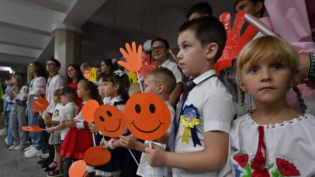 Pupils attend a ceremony held in a subway station to mark the beginning of the new school year. Picture: Sergey Bobok/AFP