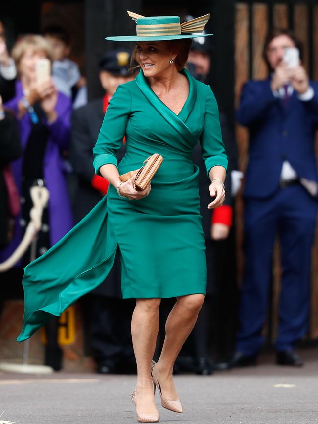 The mother of the bride, arrives to a sea of cheers. Picture: AFP