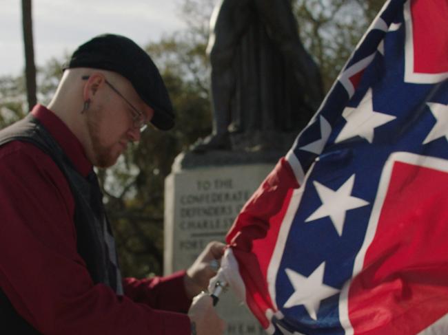 ***STRICTLY EMBARGOED FOR SUN OCT 20 2019***Still from Discovery Channel documentary series, Why We Hate - James Bessenger of the South Carolina Secessionist Party unfurls his Confederate Flag.