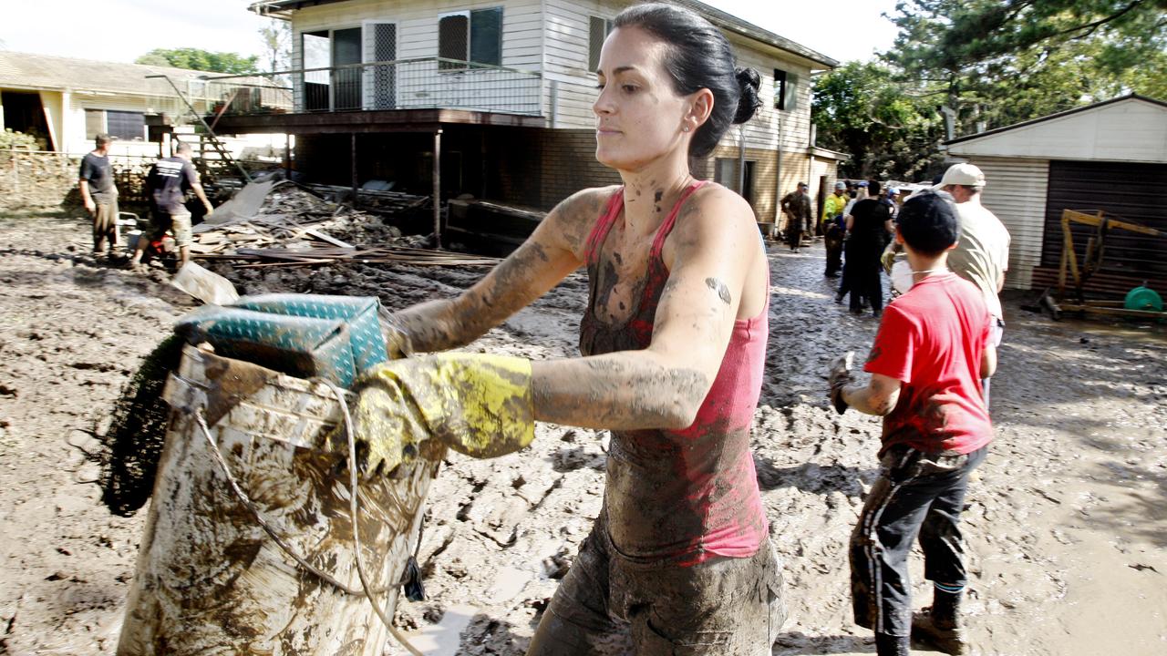 Gold Coast resident Aleaysha Burney helping with the flood clean up at Brisbane Tce, Goodna on Saturday. Photo: Sarah Harvey/ The Queensland Times IPS200111HARV20A