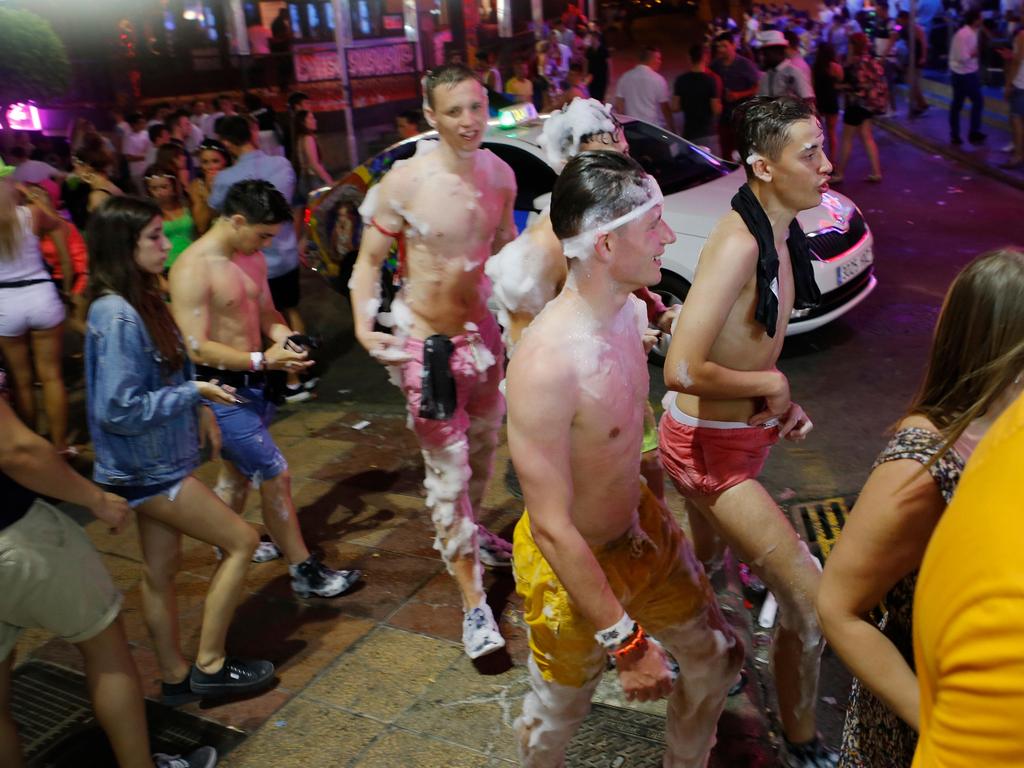 Young Brit tourists covered in foam while enjoying a holiday in Spain. Picture: Alamy