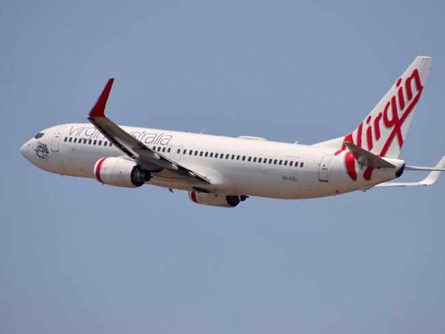 Virgin Australia plane departing from Brisbane Airport Pictures David Clark Photography