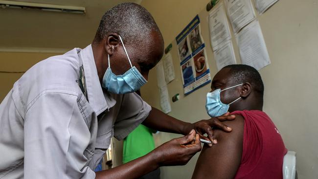 A doctor who is the first person to receive the vaccine is immunized at Banket District Hospital on February 22, 2021 in Chinhoyi, Zimbabwe. (Photo by Tafadzwa Ufumeli/Getty Images)