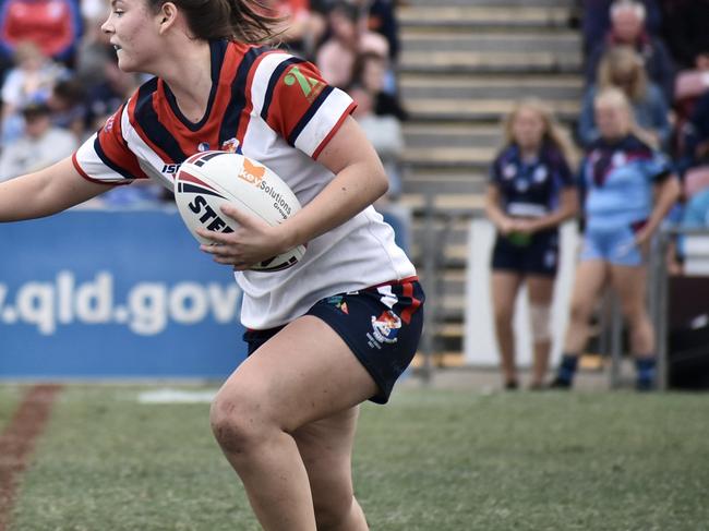 Gracie Watt looks to fend off in the Confraternity Shield Final. Picture: Max O'Driscoll.