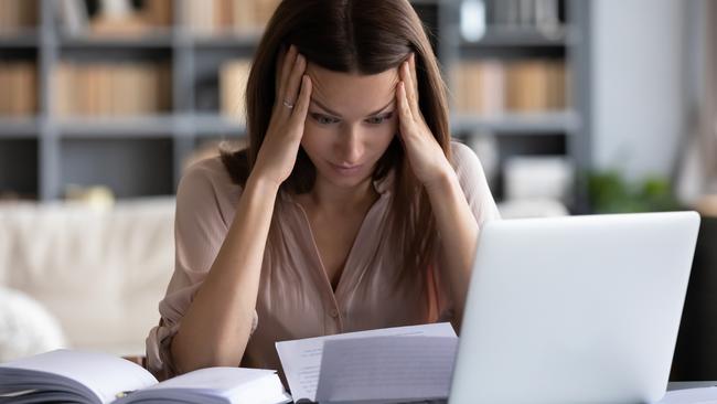 MONEY ISTOCK - Stressed young woman holding head in hands, feeling desperate about financial problems, dismissive notice, failed test. Depressed businesswoman shocked by bank loan rejection, domestic bills. Picture: Istock