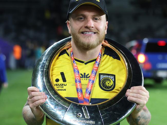 SYDNEY, AUSTRALIA - JUNE 03: Jason Cummings of the Mariners post game with the A-League trophy during the 2023 A-League Men's Grand Final match between Melbourne City and Central Coast Mariners at CommBank Stadium, on June 03, 2023, in Sydney, Australia. (Photo by Scott Gardiner/Getty Images)